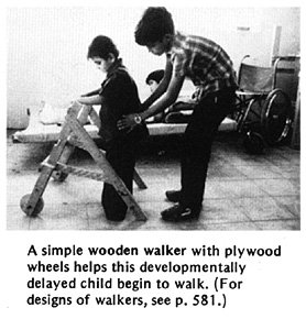 A simple wooden walker with plywood wheels