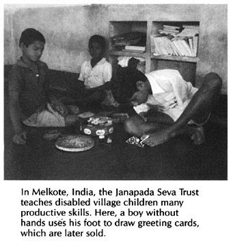 A boy without hands uses his foot to draw greeting cards, which are later sold.