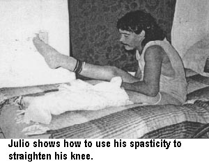 Julio shows how to use his spasticity to straighten his knee.