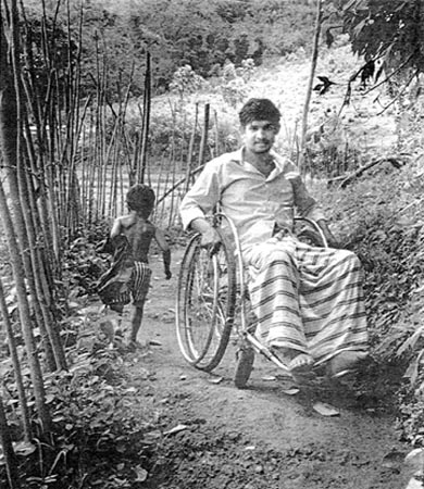 Wheelchair in footpath.