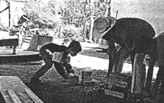 Carrying the bricks and place them on the ground to support the boards.