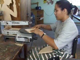 Cutting the sides of the chair with a scrollsaw.